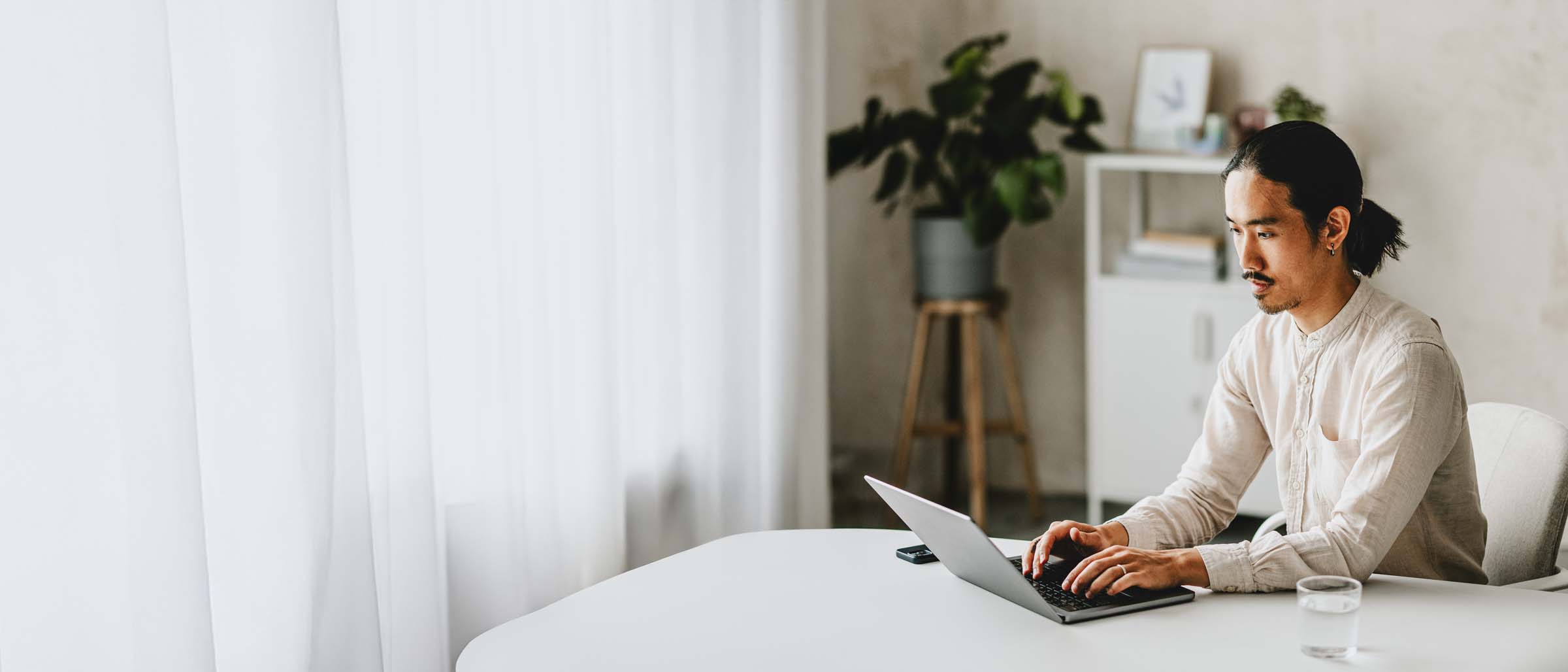 Man working on laptop in modern office