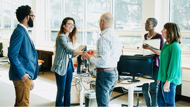 Businesswoman shaking handing with client before meeting in start-up office