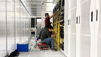 Technician working on a data center to make it AI-ready