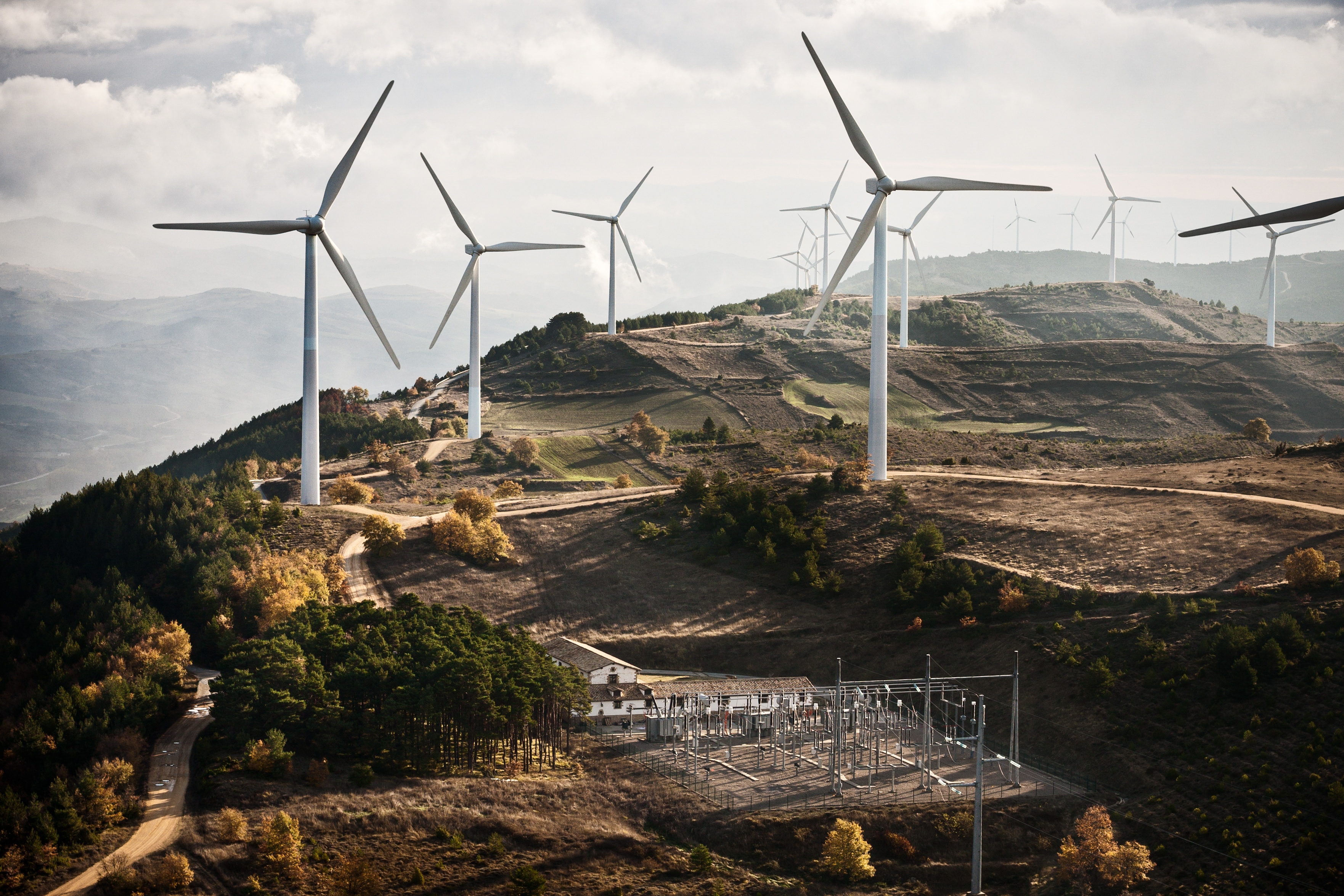 Wind turbines on a hill.